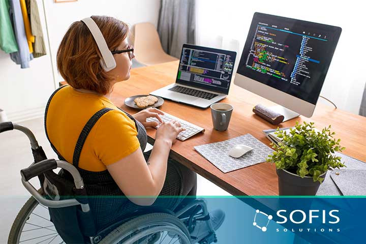 Person in a wheelchair working at a computer
